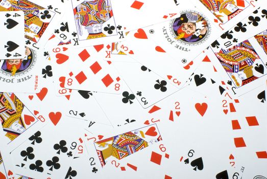 Background from the playing cards which have been spread out in a chaotic order