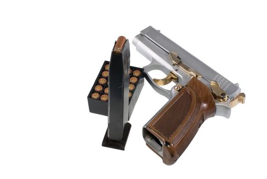 Silvery pistol, holder and pack of cartridges, on a white background.