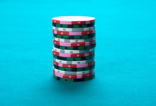 Pile of multi-coloured counters on green cloth