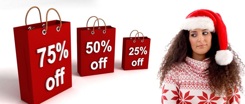 woman wearing christmas hat posing with three dimensional shopping bag 