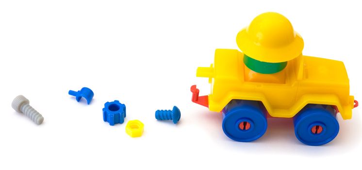 Yellow plastic toy machine with blue wheels