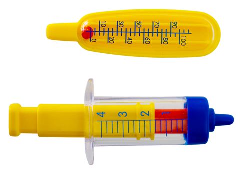 Toy plastic thermometer and syringe on the white background