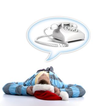 laying man with christmas hat watching telephone in speech bubble