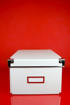 Storage boxes isolated against a red background