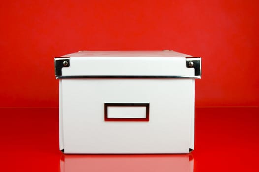 Storage boxes isolated against a red background