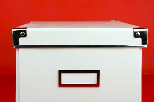 Storage boxes isolated against a red background