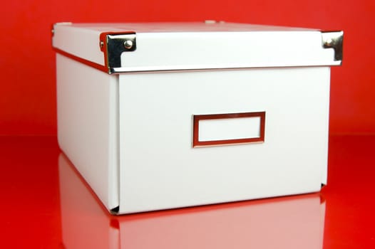 Storage boxes isolated against a red background