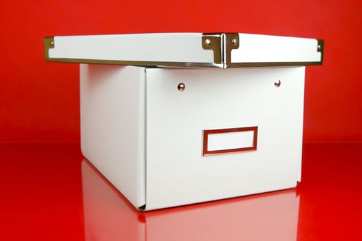 Storage boxes isolated against a red background