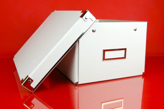 Storage boxes isolated against a red background