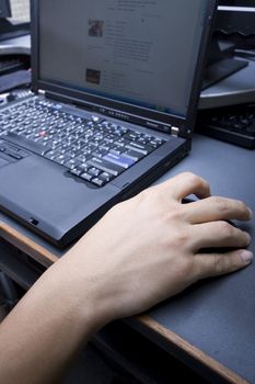 Close up of woman's hands using keyboard and mouse 