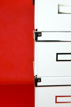 Storage boxes isolated against a red background