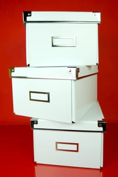 Storage boxes isolated against a red background