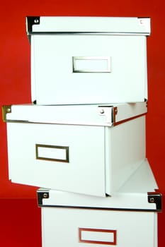 Storage boxes isolated against a red background