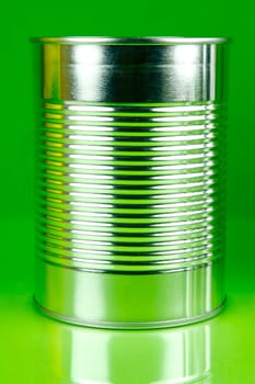 Storage tins isolated against a green background