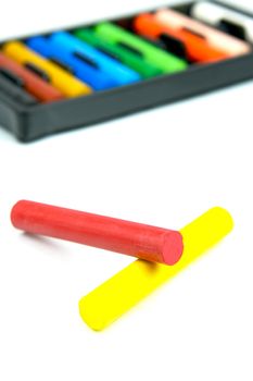 Oil pastels/crayons isolated against a white background