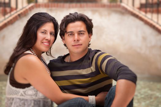 Attractive Hispanic Couple Portrait Enjoying Each Other Outdoors.