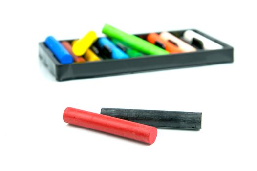 Oil pastels/crayons isolated against a white background