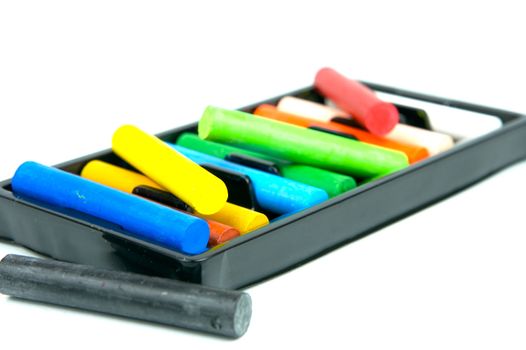 Oil pastels/crayons isolated against a white background