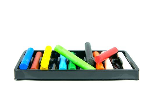 Oil pastels/crayons isolated against a white background