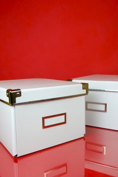 Storage boxes isolated against a red background