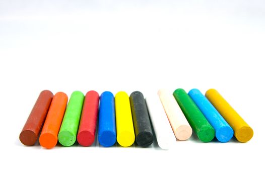 Oil pastels/crayons isolated against a white background