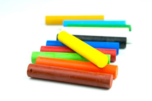 Oil pastels/crayons isolated against a white background