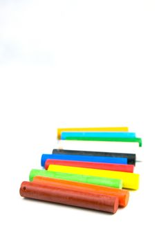 Oil pastels/crayons isolated against a white background