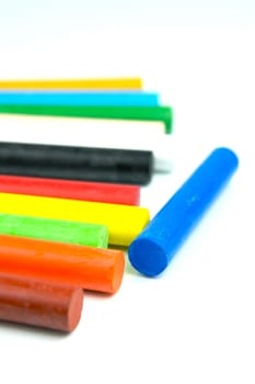 Oil pastels/crayons isolated against a white background