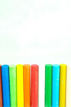 Oil pastels/crayons isolated against a white background