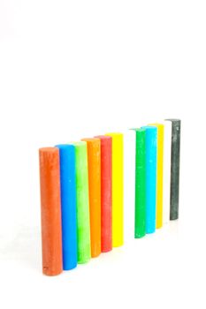 Oil pastels/crayons isolated against a white background