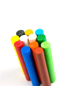 Oil pastels/crayons isolated against a white background