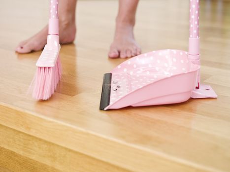 Cleaning the floor with a dust-brush