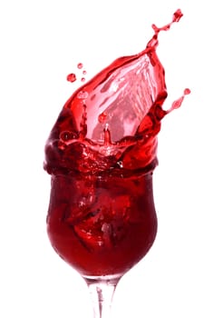 Goblet with splashing cherry juice isolated on white background with clipping path