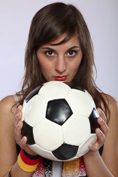 Serious German Soccer Fan Girl Holding The Ball