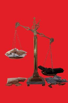 an antique scales against a red background with drugs and gun depicting drug crime