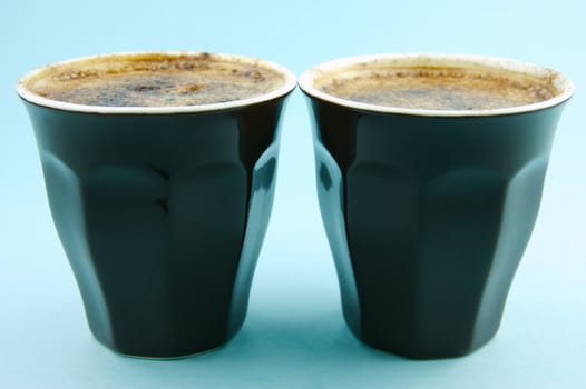 Cappuccinos isolated against a blue background