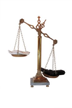an antique scales against a white background with drugs and gun depicting drug crime with clipping path