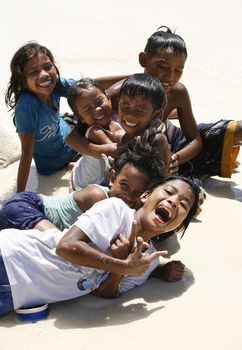 Philippines. Island Boracay. October. 2008. Cheerful Philippine children on coast of ocean. 
