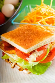 fresh and delicious classic club sandwich over a transparent glass dish