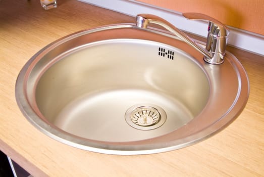 Stainless steel sink on the kitchen