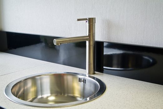 Stainless steel sink on the kitchen
