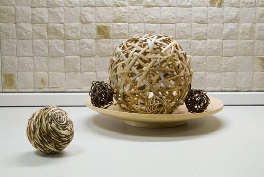 Some straw spheres in kitchen still-life