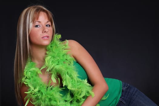 beautiful young woman with feather boa