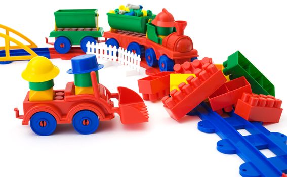 Toy colored railway and toy plastic machine