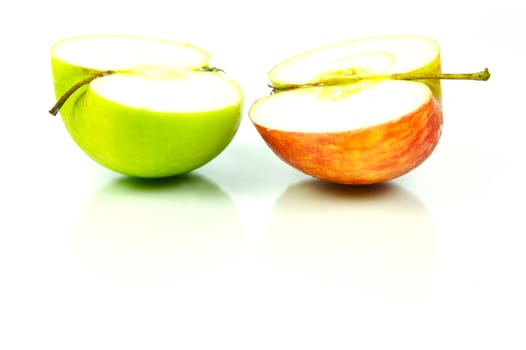 Red and green apples isolated against a white background