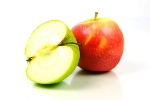 Red and green apples isolated against a white background