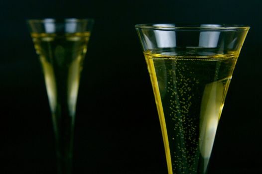 Sparkling wine isolated against a black background