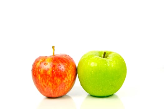 Red and green apples isolated against a white background