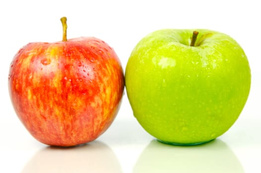 Red and green apples isolated against a white background