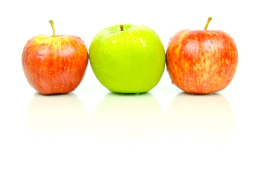 Red and green apples isolated against a white background